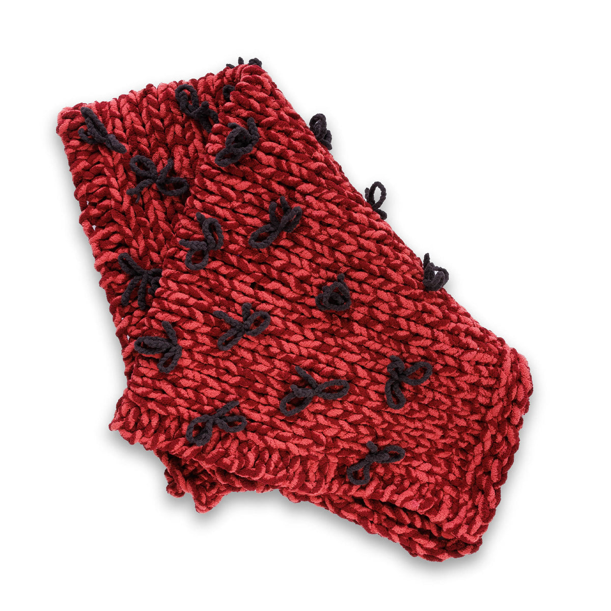 Put A Bow On It Table Knit Blanket made using Bernat yarn in a styled lifestyle setting