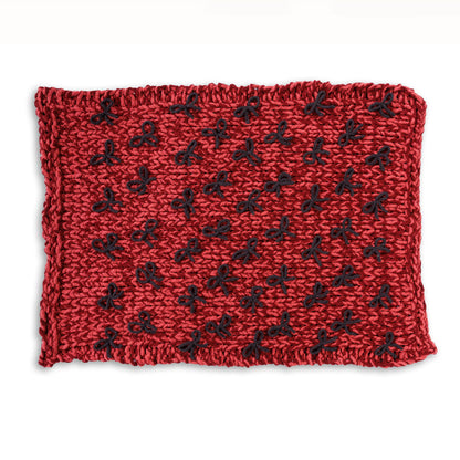Bernat Put a Bow on it Table Knit Blanket Put A Bow On It Table Knit Blanket made using Bernat yarn on a white background