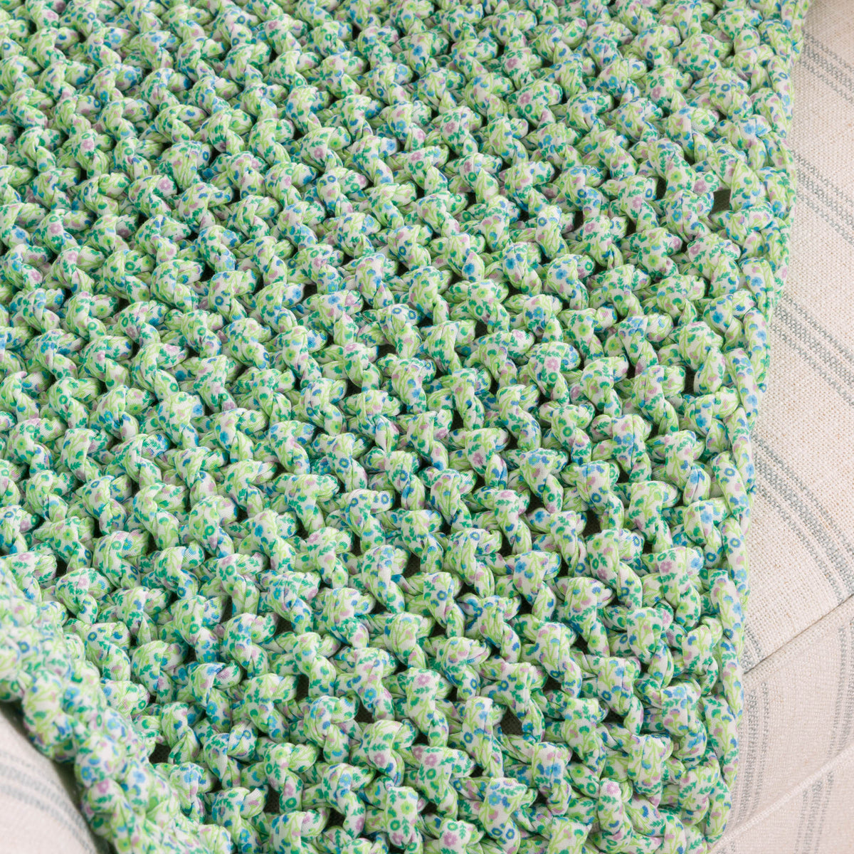 Flowers & Seed Stitch Knit Blanket made using Bernat yarn
