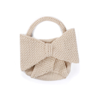 Caron Crochet Bow Bag Crochet Bow Bag made using Caron yarn on a white background
