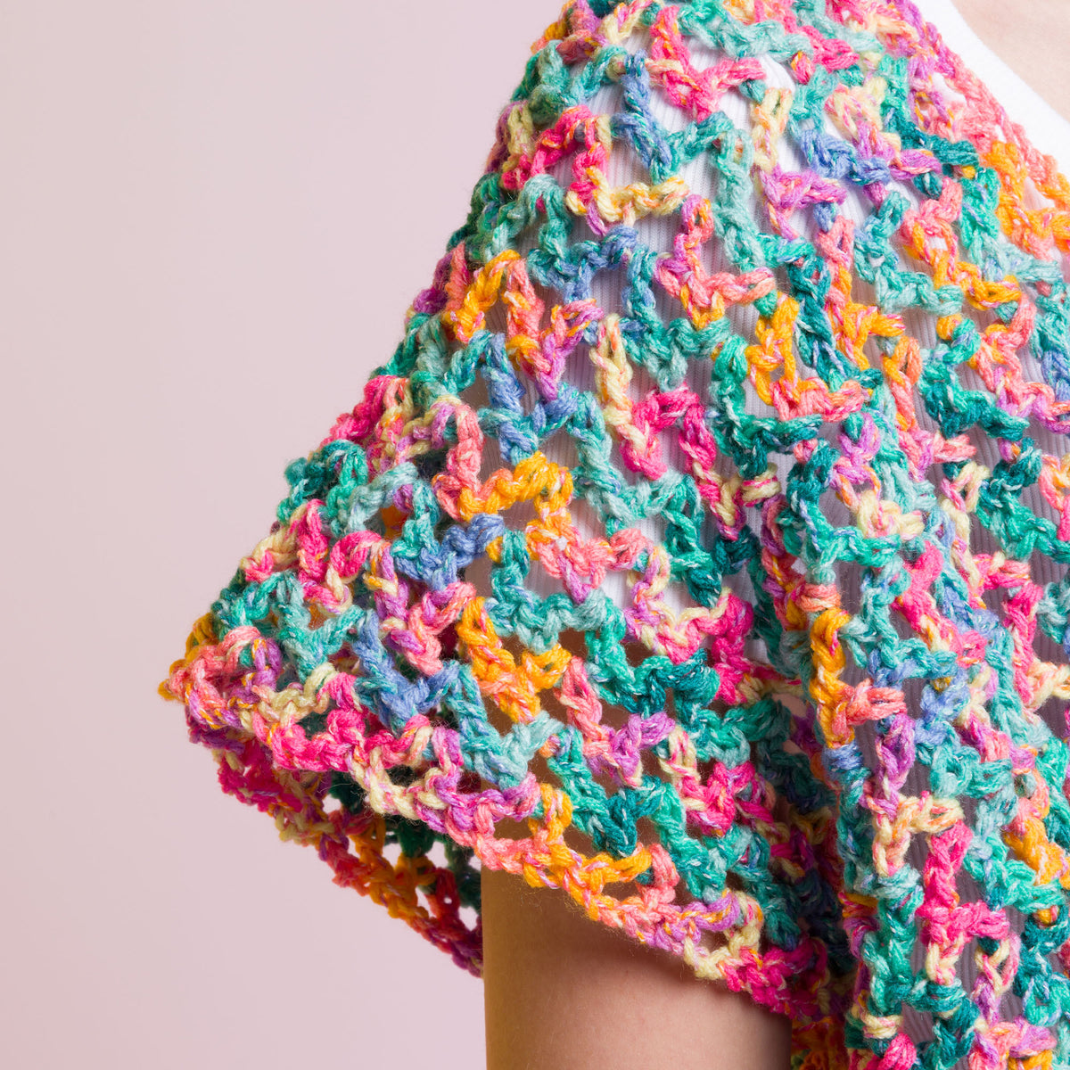 Crochet Side To Side Stripe Top made using Caron yarn in a styled lifestyle setting