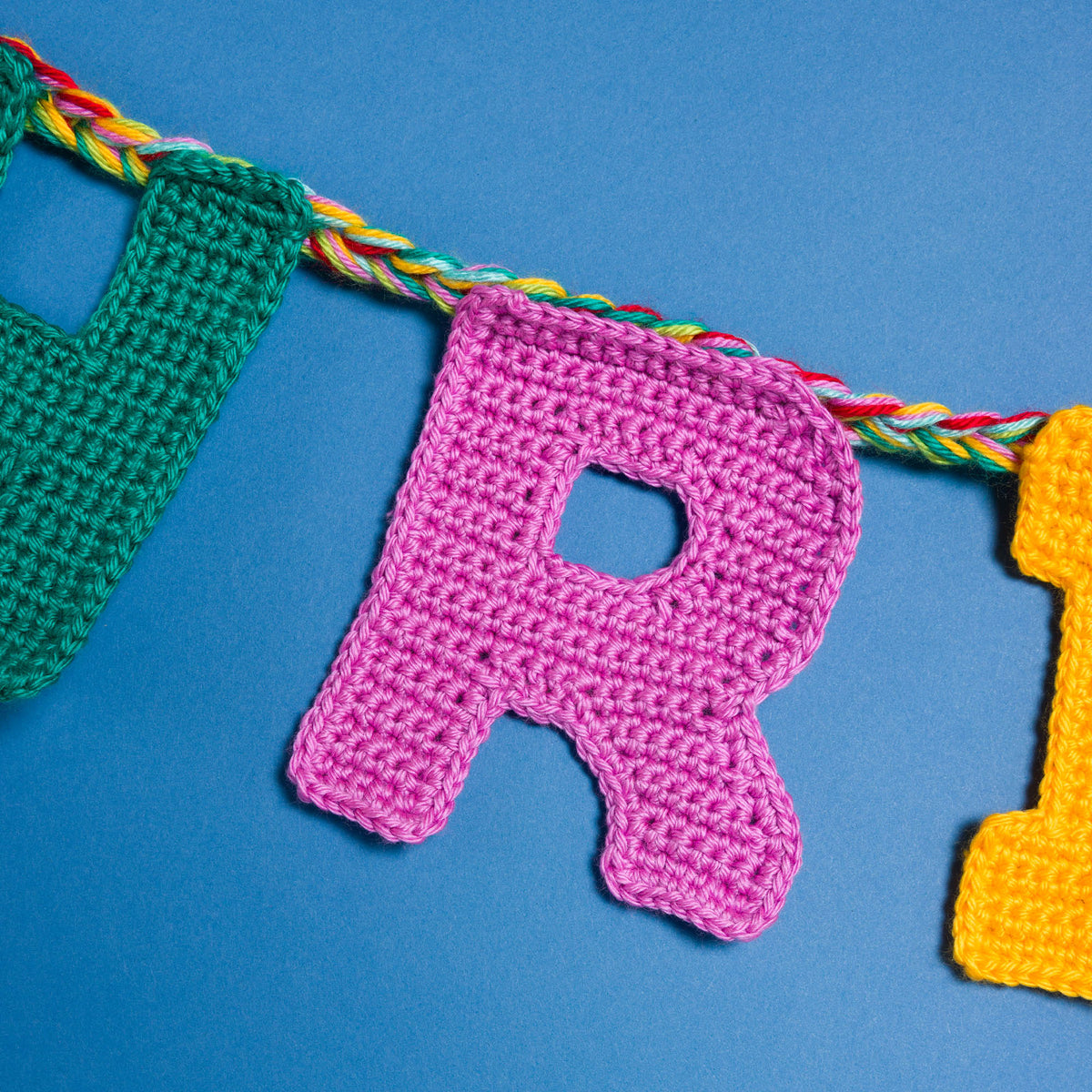 Crochet Merry Christmas Garland made using Caron yarn