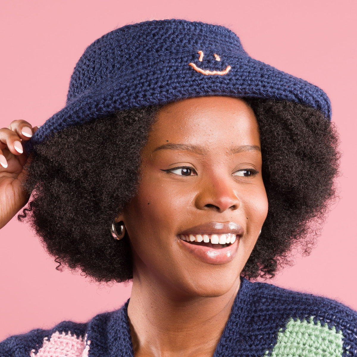 Crochet Bright Smile Bucket Hat made using Caron yarn
