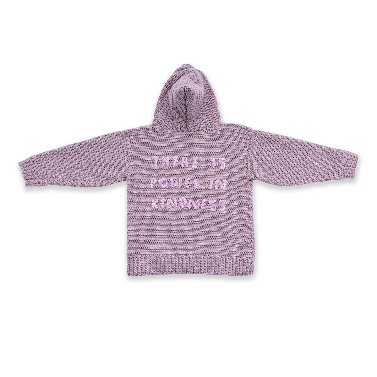Shimmering Phrase On Crochet Pullover made using Caron yarn in a styled lifestyle setting