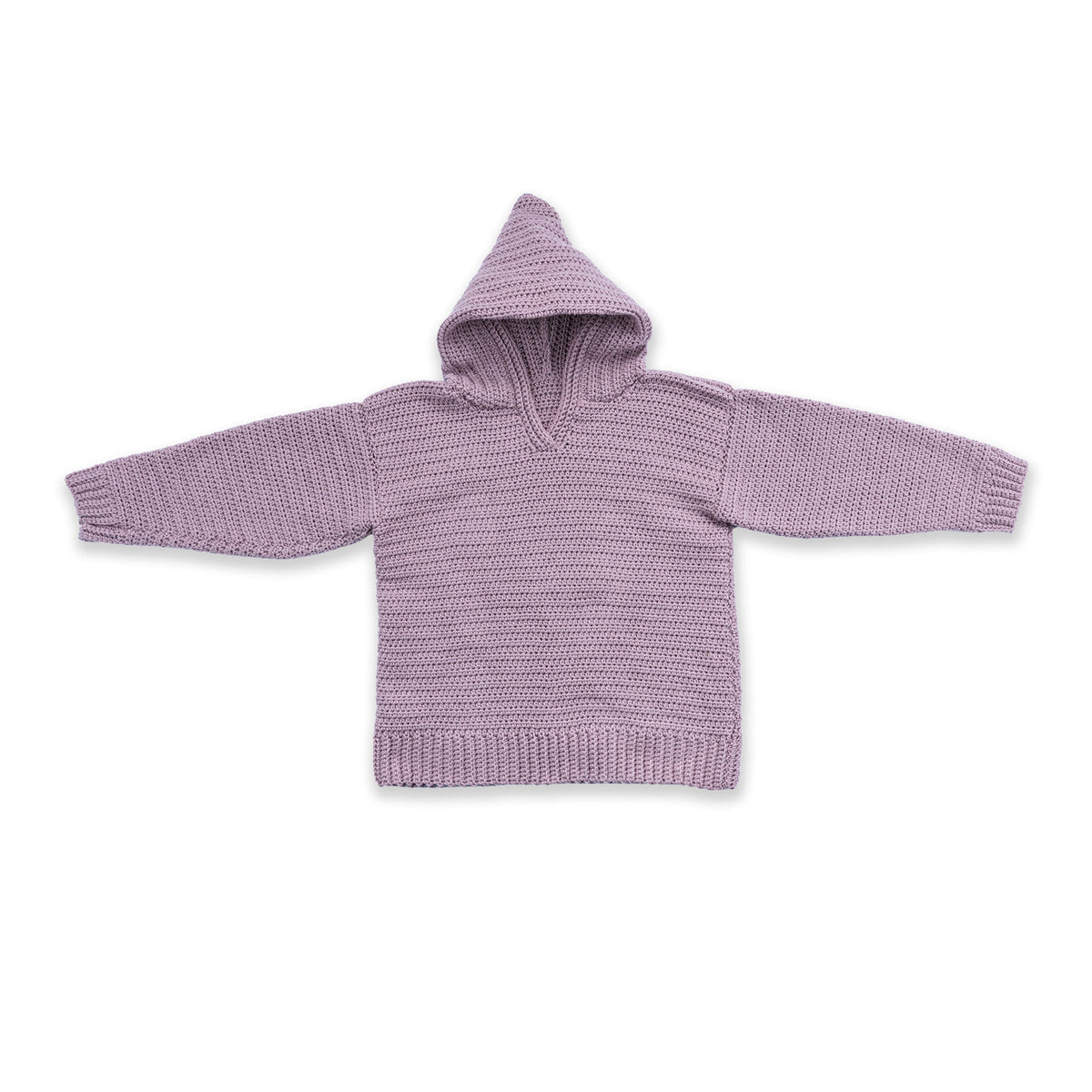 Shimmering Phrase On Crochet Pullover made using Caron yarn on a white background