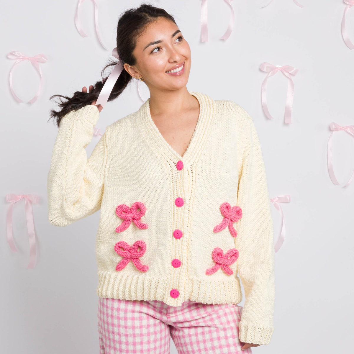 Bows On The Go Cardigan made using Caron yarn