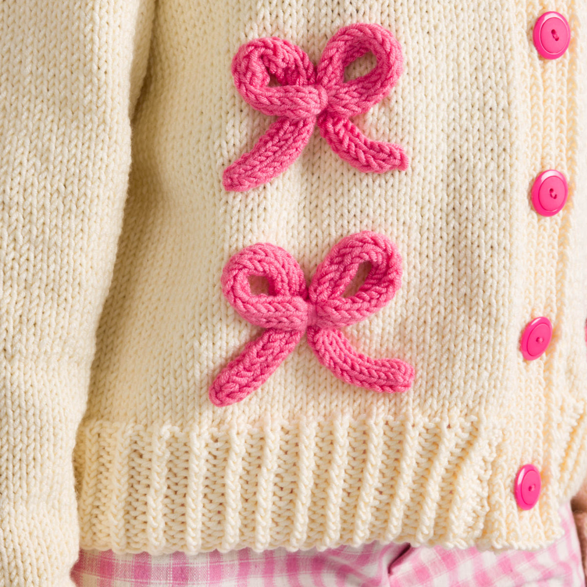 Bows On The Go Cardigan made using Caron yarn