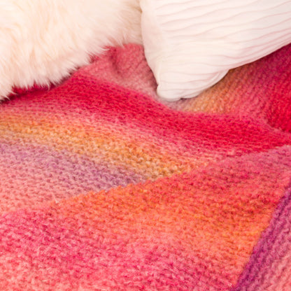 Caron Patchwork Triangles Knit Blanket Patchwork Triangles Knit Blanket made using Caron yarn