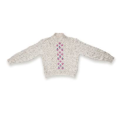 Caron Floral Medallions Knit Pullover Floral Medallions Knit Pullover made using Caron yarn on a white background