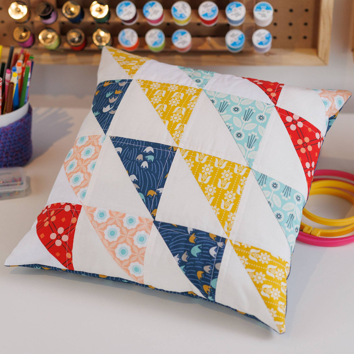& Clark Half Square Triangle Quilted Pillow made using Coats yarn