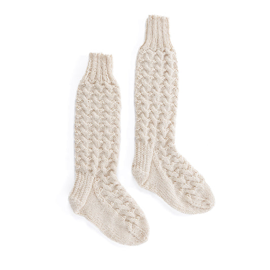 Pair of beige knitted socks using Patons yarn.