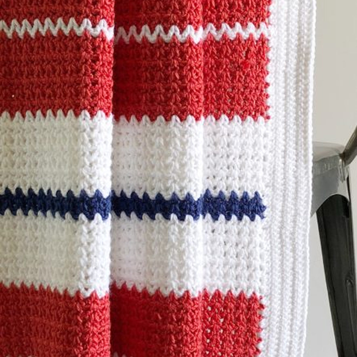 Americana V-Stitch Crochet Blanket made using Modern yarn in a styled lifestyle setting