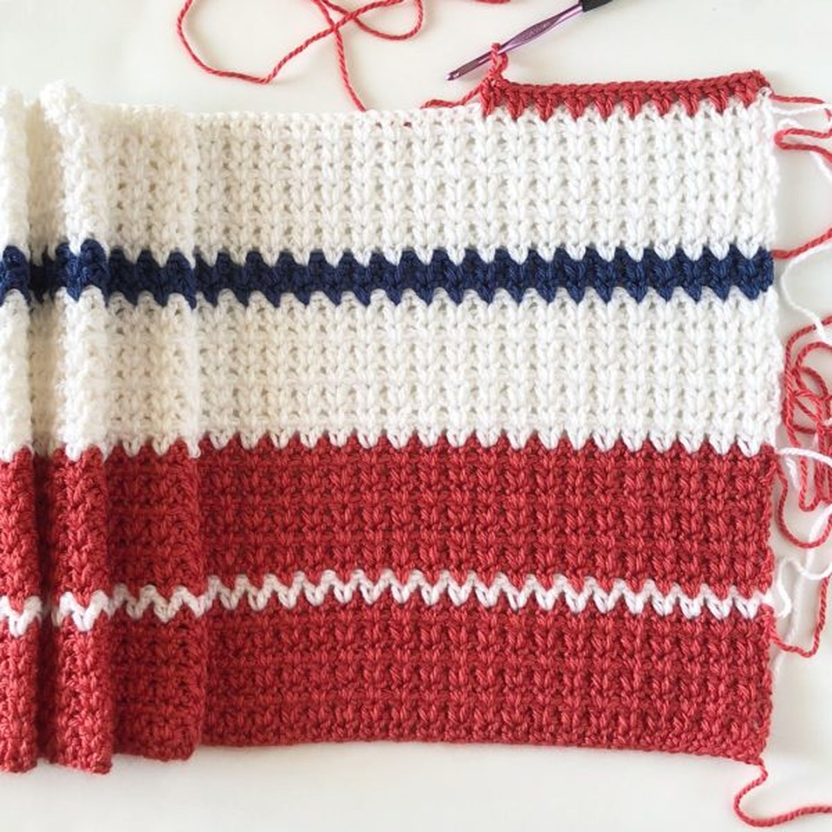 Americana V-Stitch Crochet Blanket made using Modern yarn in a styled lifestyle setting