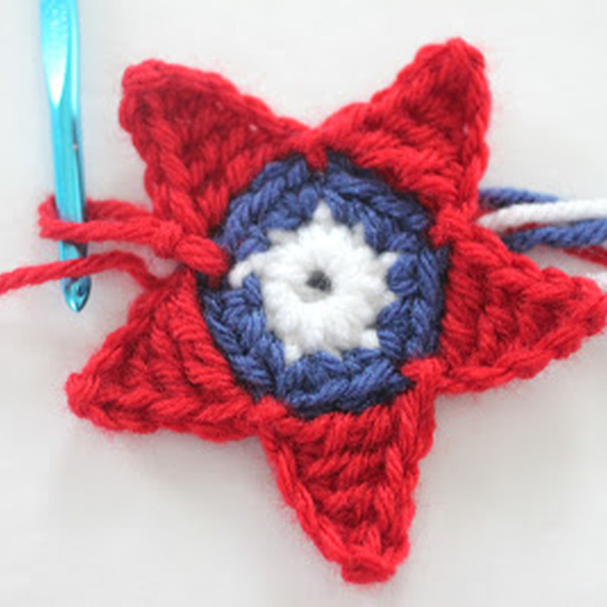 Americana Crochet Stars made using Red Heart yarn in a styled lifestyle setting