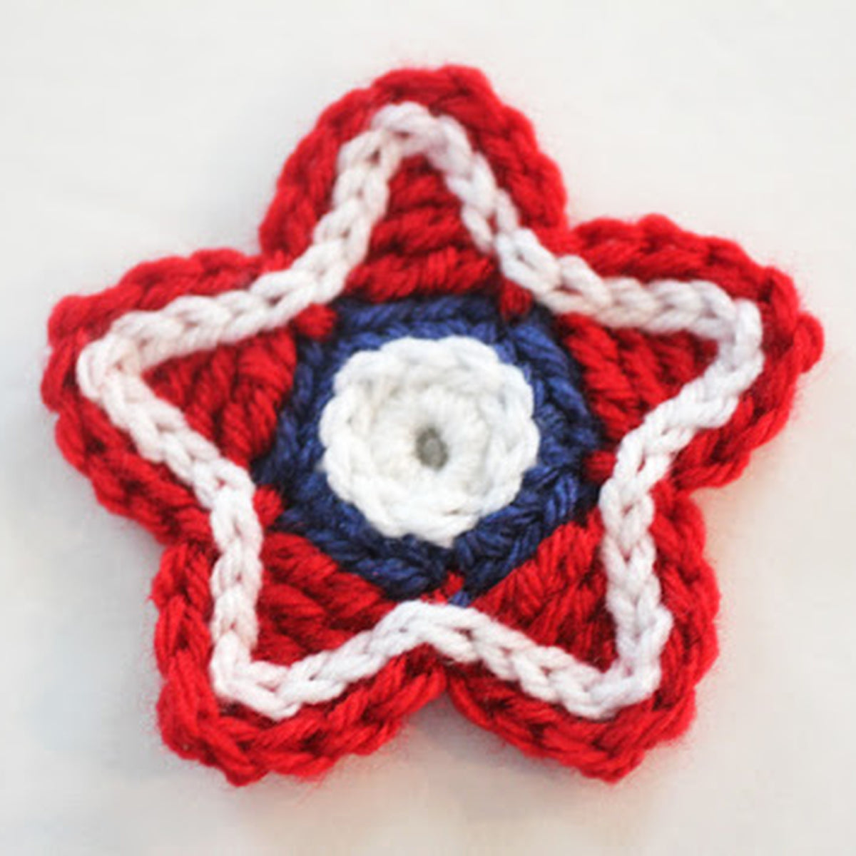 Americana Crochet Stars made using Red Heart yarn in a styled lifestyle setting