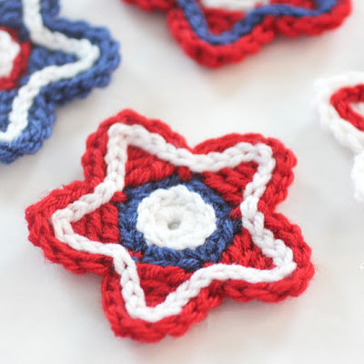 Americana Crochet Stars made using Red Heart yarn in a styled lifestyle setting