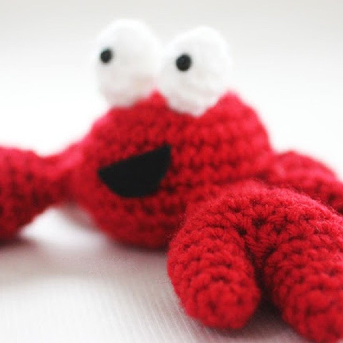 Feeling Crabby Crochet Amigurumi made using Red Heart yarn in a styled lifestyle setting