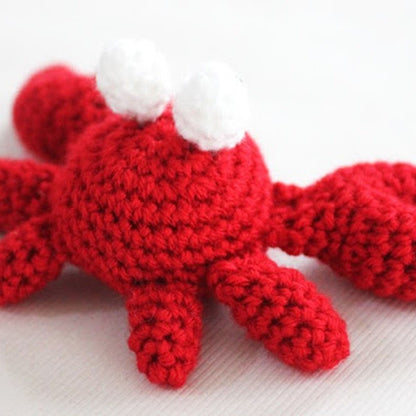 Red Heart Feeling Crabby Crochet Amigurumi Feeling Crabby Crochet Amigurumi made using Red Heart yarn in a styled lifestyle setting
