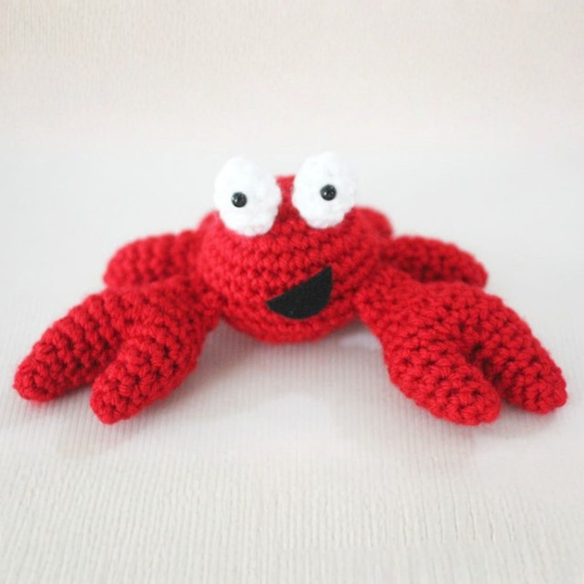Feeling Crabby Crochet Amigurumi made using Red Heart yarn in a styled lifestyle setting