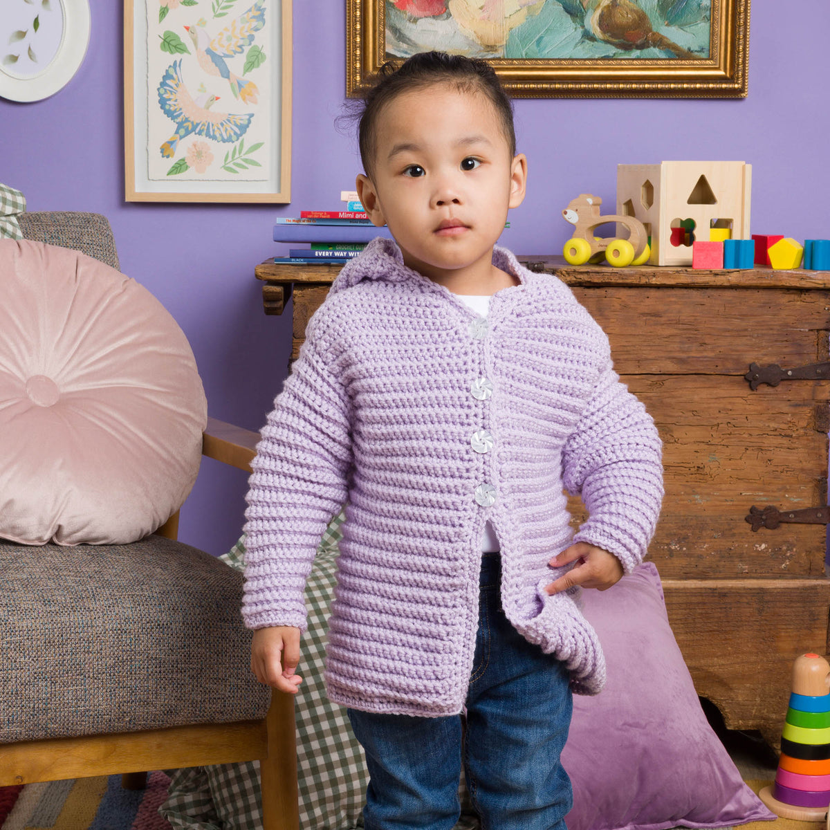 Little Lovebug Crochet Cardigan made using Red Heart yarn