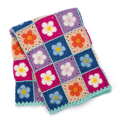 Red Heart Crochet Flower Bed Blanket A crocheted blanket with a colorful floral pattern made using Red Heart All in One Flower Power yarn, Version 2