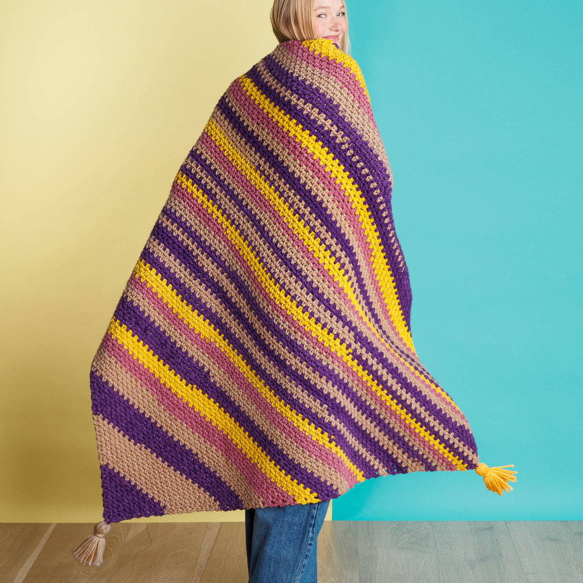 Crochet Super Stripes On-A-Bias Blanket made using Red Heart yarn