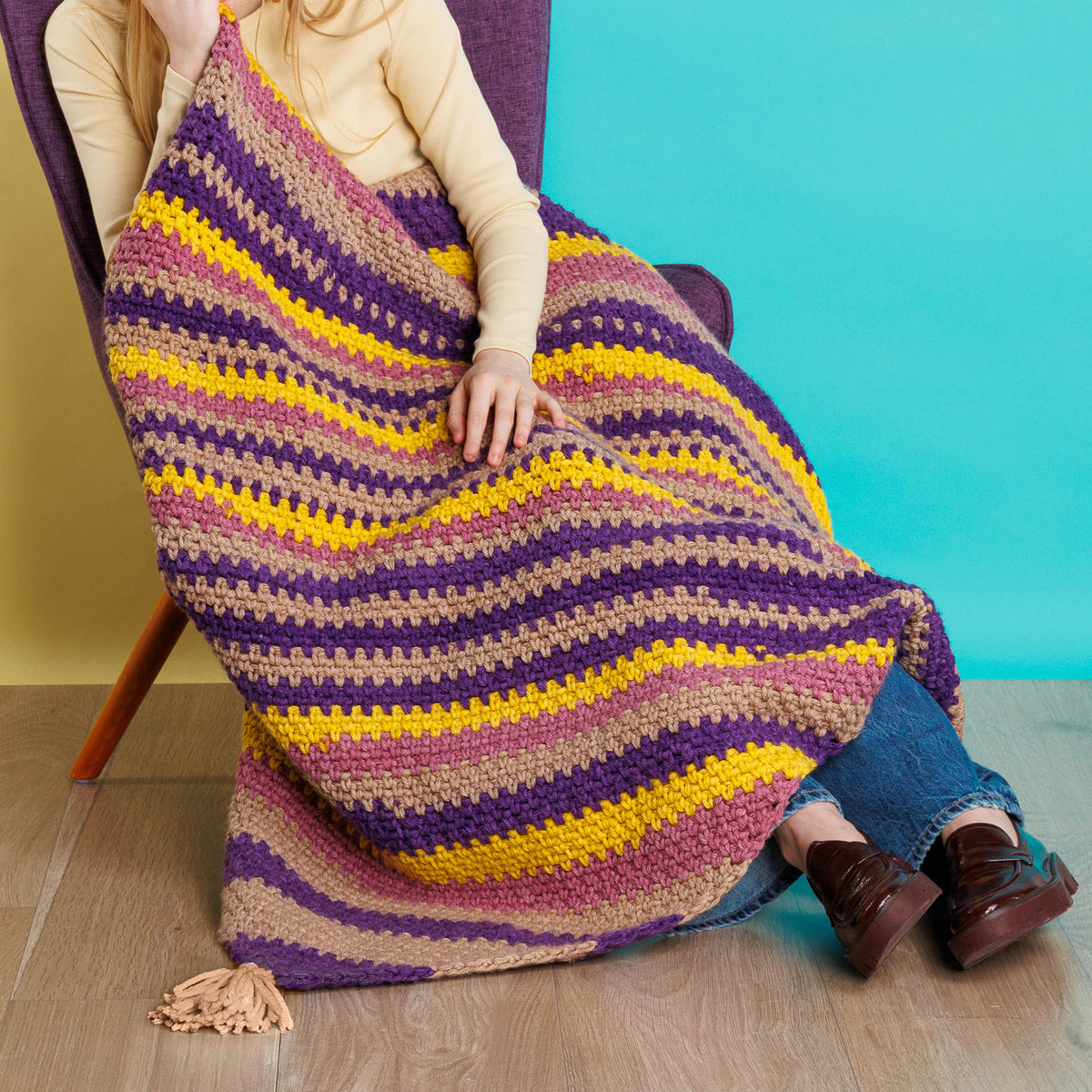 Crochet Super Stripes On-A-Bias Blanket made using Red Heart yarn