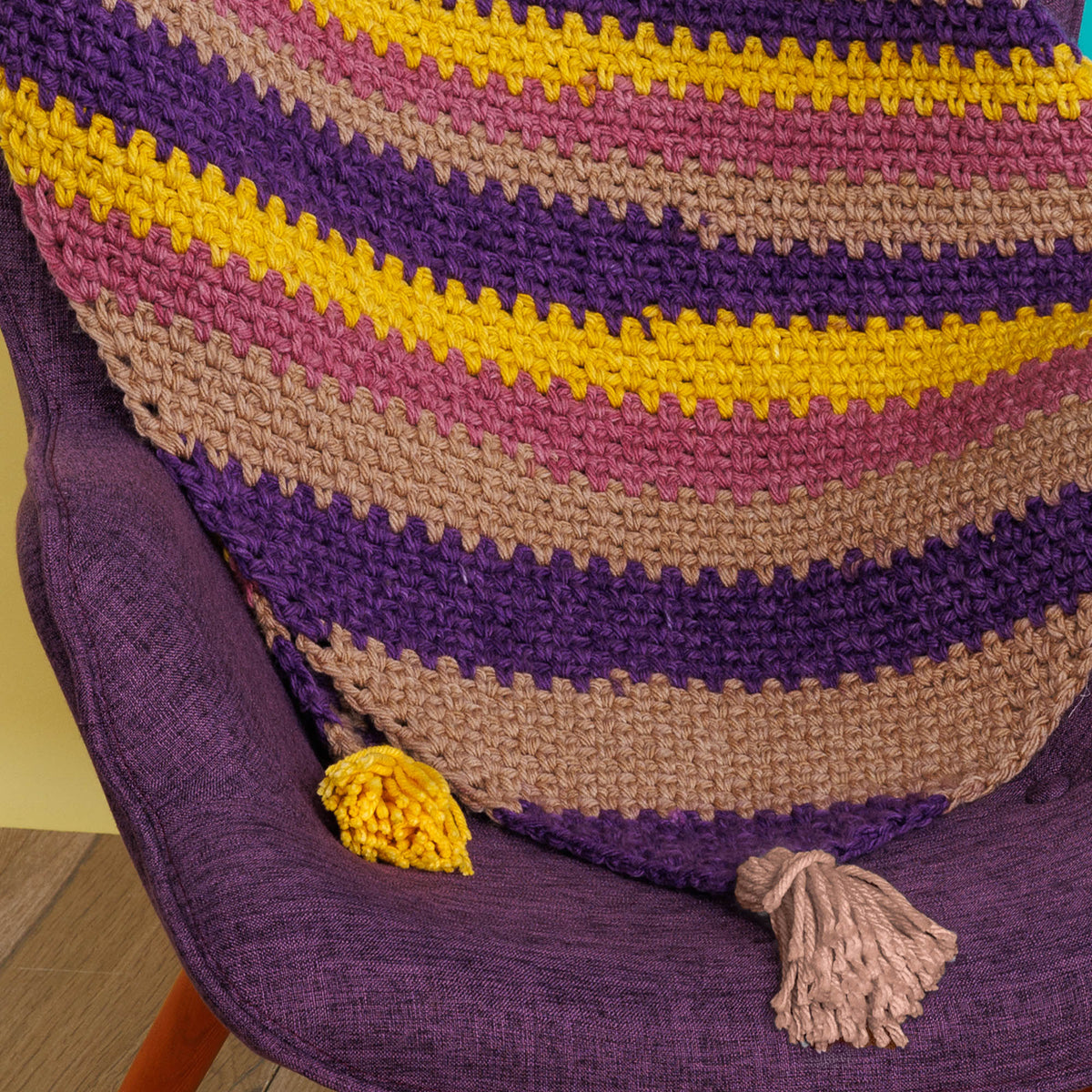 Crochet Super Stripes On-A-Bias Blanket made using Red Heart yarn