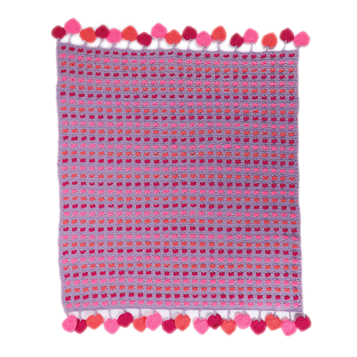 Love Crochet Blanket made using Red Heart yarn in a styled lifestyle setting