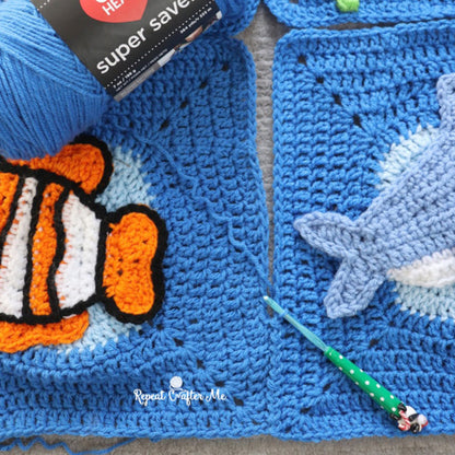 Red Heart Under the Sea Crochet Blanket Under The Sea Crochet Blanket made using Red Heart yarn in a styled lifestyle setting
