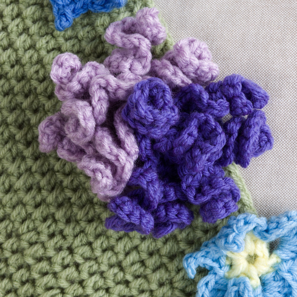 Crochet Blooming Bouquet Blanket made using Red Heart yarn