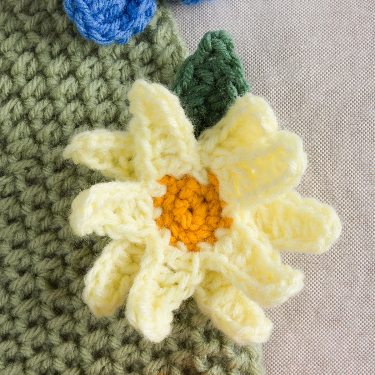 Crochet Blooming Bouquet Blanket made using Red Heart yarn