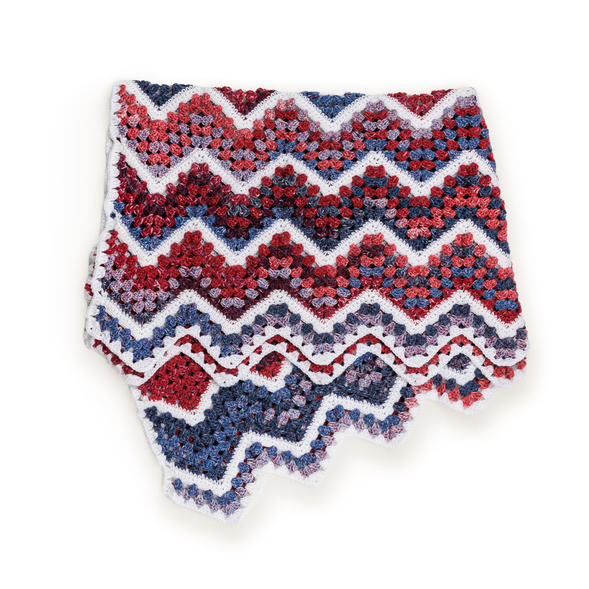 Crochet Firework Throw made using Red Heart yarn in a styled lifestyle setting