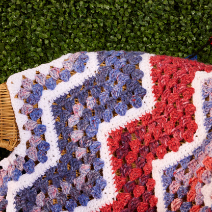 Red Heart Crochet Firework Throw Crochet Firework Throw made using Red Heart yarn in a styled lifestyle setting