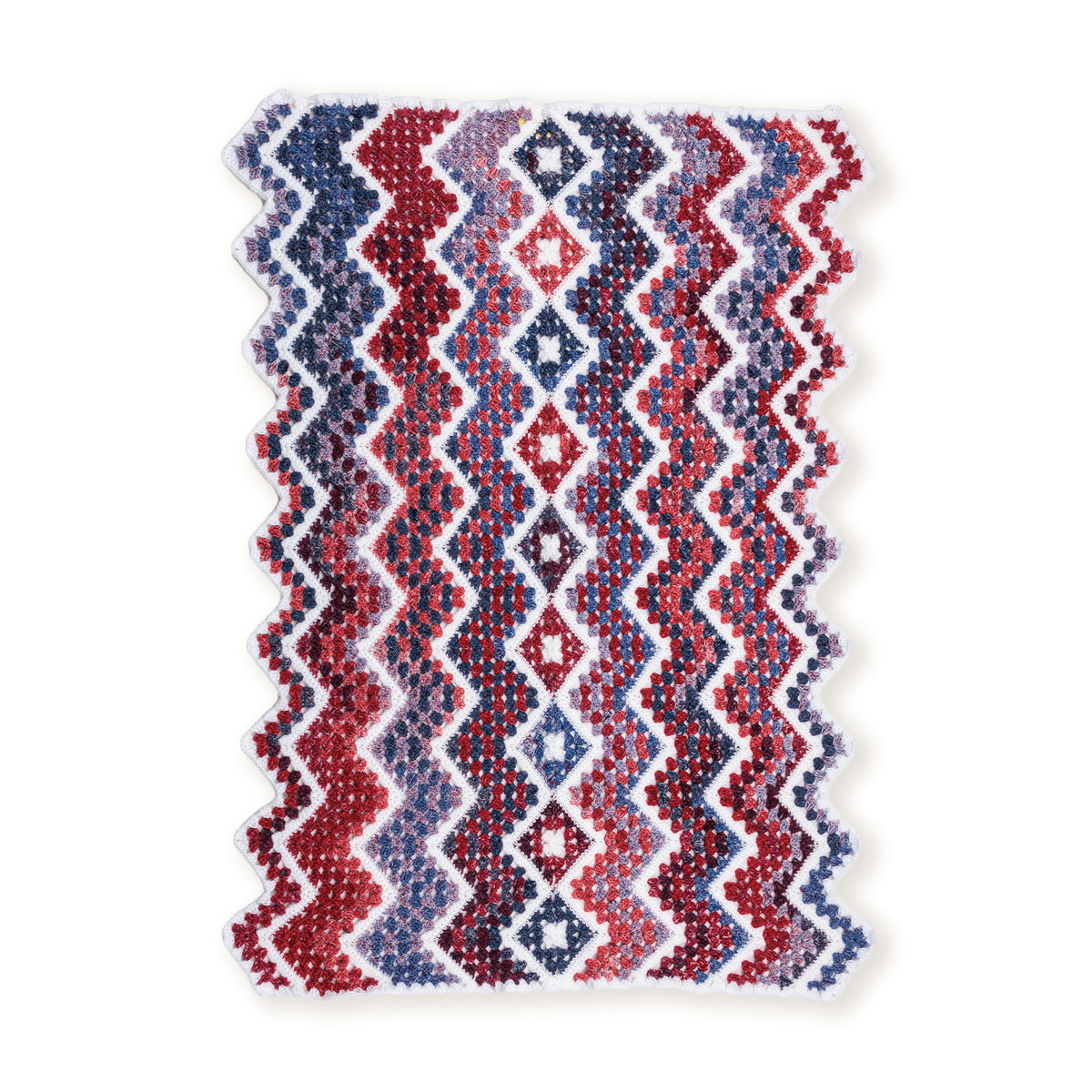 Crochet Firework Throw made using Red Heart yarn on a white background
