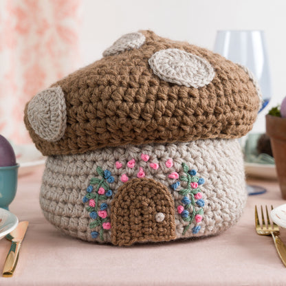 Red Heart Forest Floor Crochet Basket Forest Floor Crochet Basket made using Red Heart yarn in a styled lifestyle setting