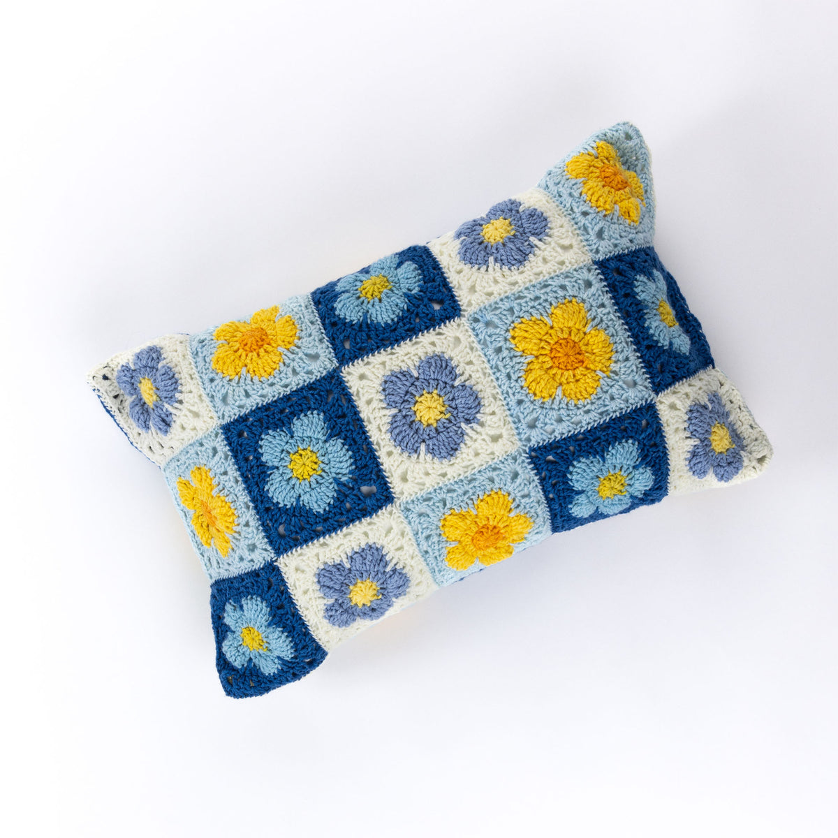 Crochet Bluebell Meadow Pillow made using Red Heart yarn
