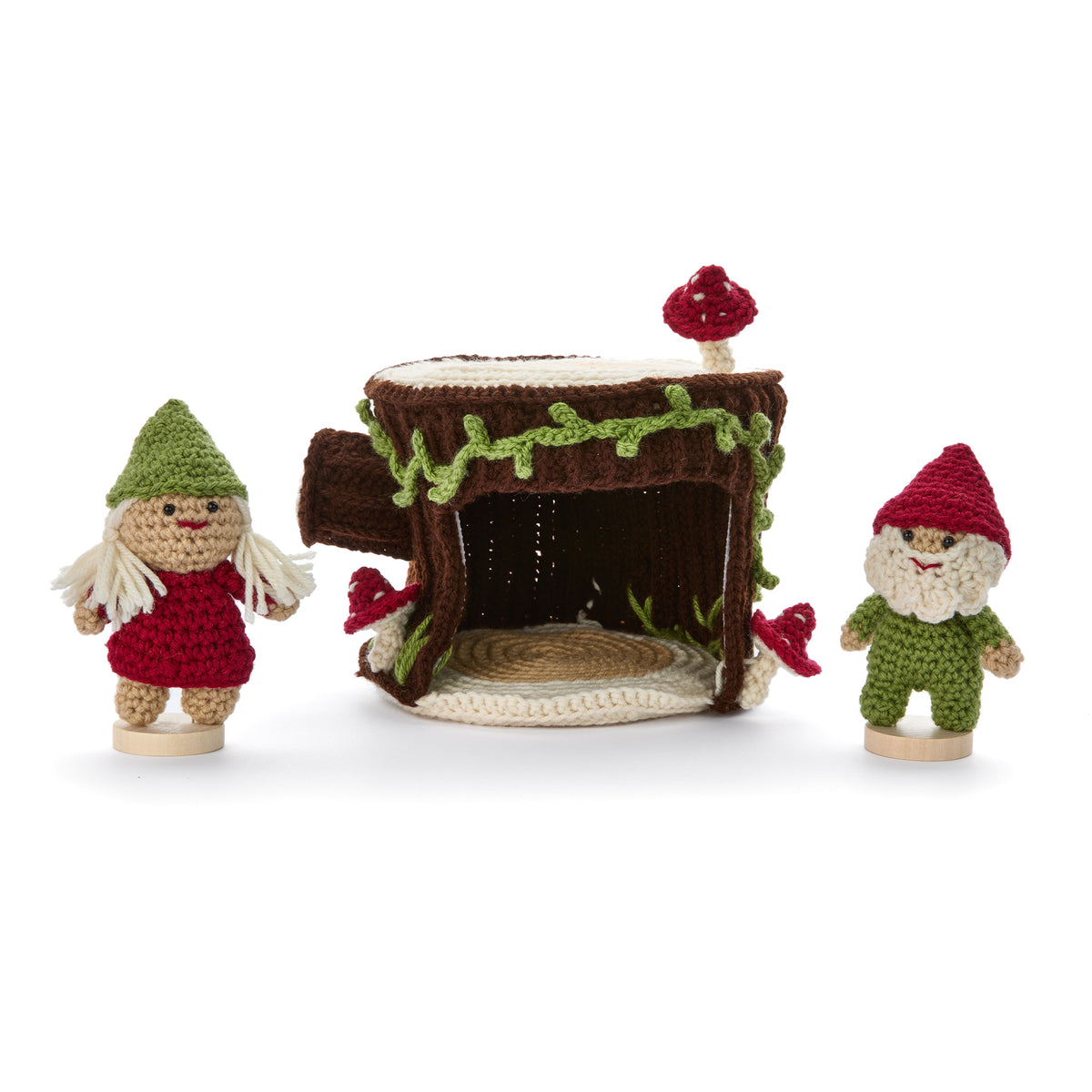 Crochet Gnomes With A Little Stump House made using Red Heart yarn in a styled lifestyle setting