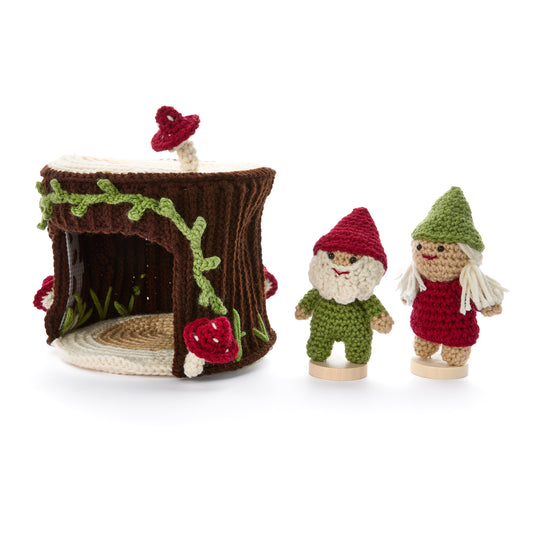 Crochet Gnomes With A Little Stump House made using Red Heart yarn in a styled lifestyle setting