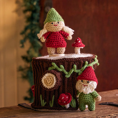 Red Heart Crochet Gnomes with a Little Stump House Crochet Gnomes With A Little Stump House made using Red Heart yarn in a styled lifestyle setting