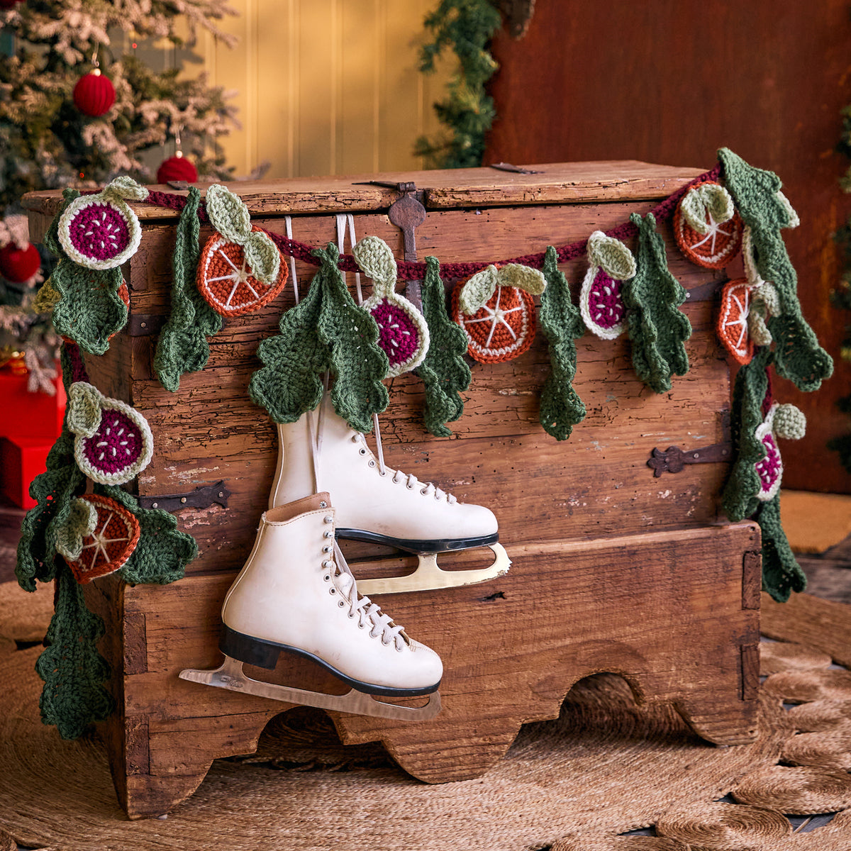 Festive Abundance Crochet Garland made using Red Heart yarn in a styled lifestyle setting