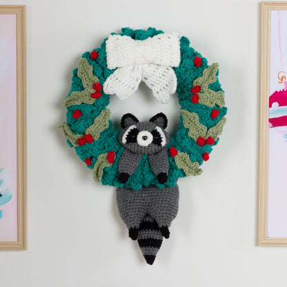 Red Heart Merry Mischief Crochet Wreath Crocheted raccoon with a crocheted wreath using Red Heart yarns.