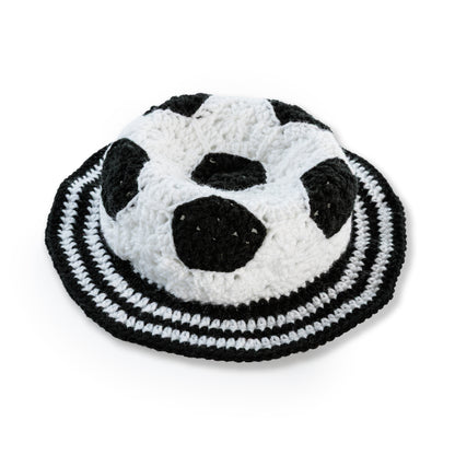 Red Heart Crochet Soccer Ball Hat Crochet Soccer Ball Hat made using Red Heart yarn in a styled lifestyle setting