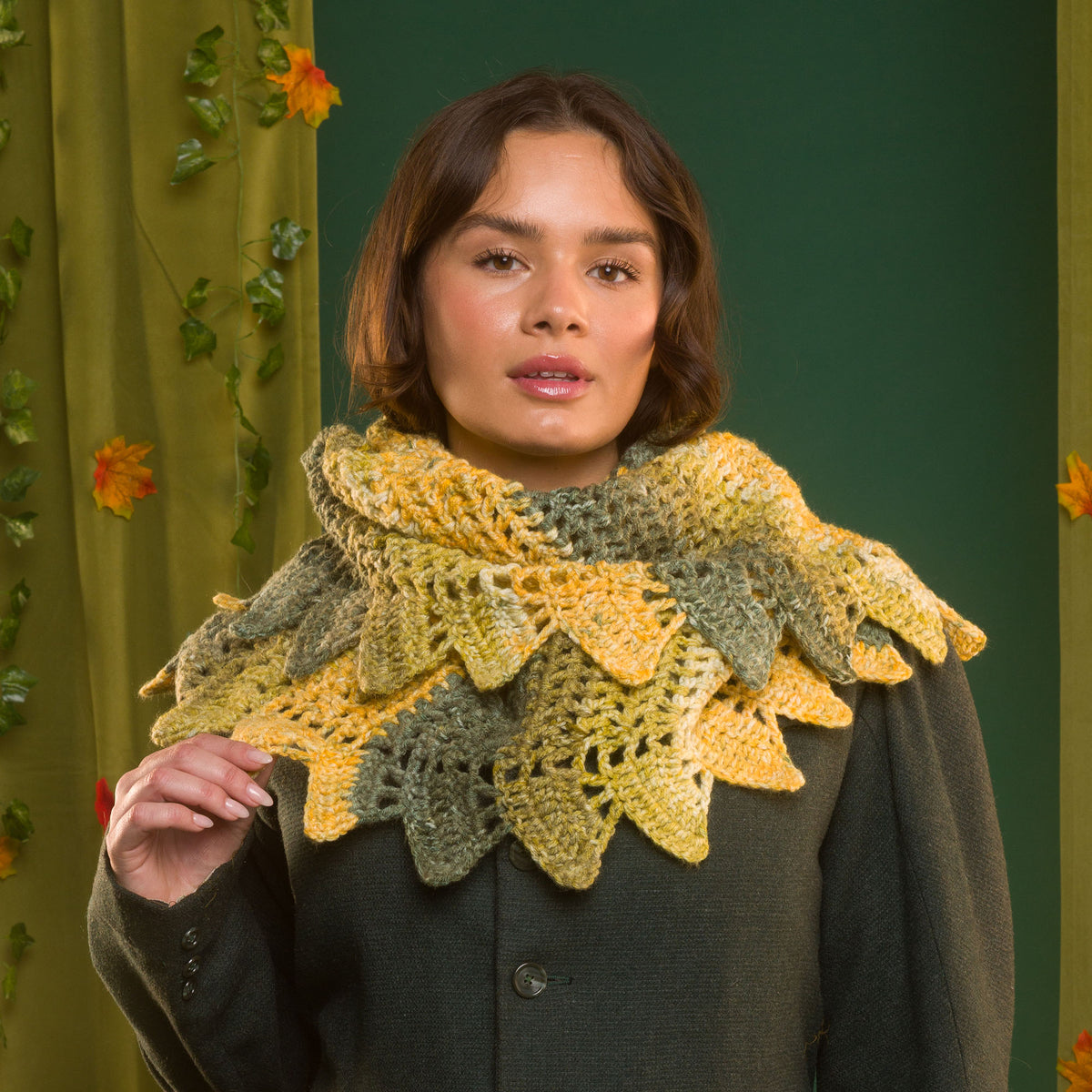 Dragon’S Hoard Crochet Shawl made using Red Heart yarn in a styled lifestyle setting