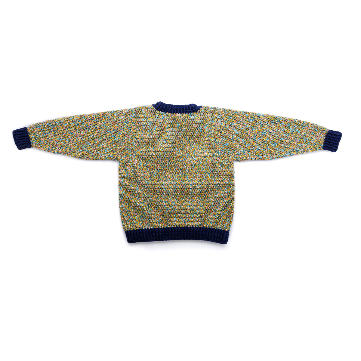 Getting Cozy Crochet Pullover made using Red Heart yarn in a styled lifestyle setting