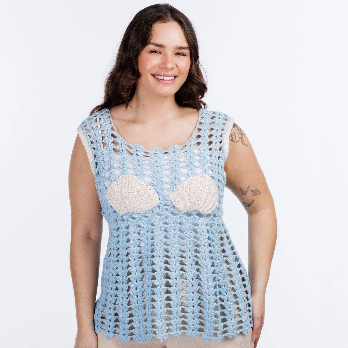 Filet Bikini Crochet Tunic made using Red Heart yarn in a styled lifestyle setting