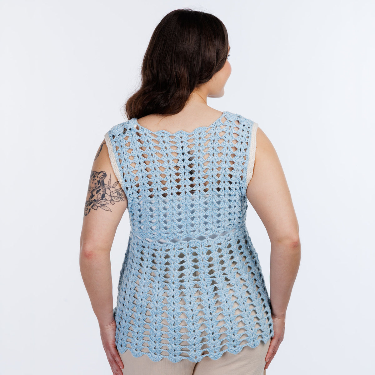 Filet Bikini Crochet Tunic made using Red Heart yarn in a styled lifestyle setting