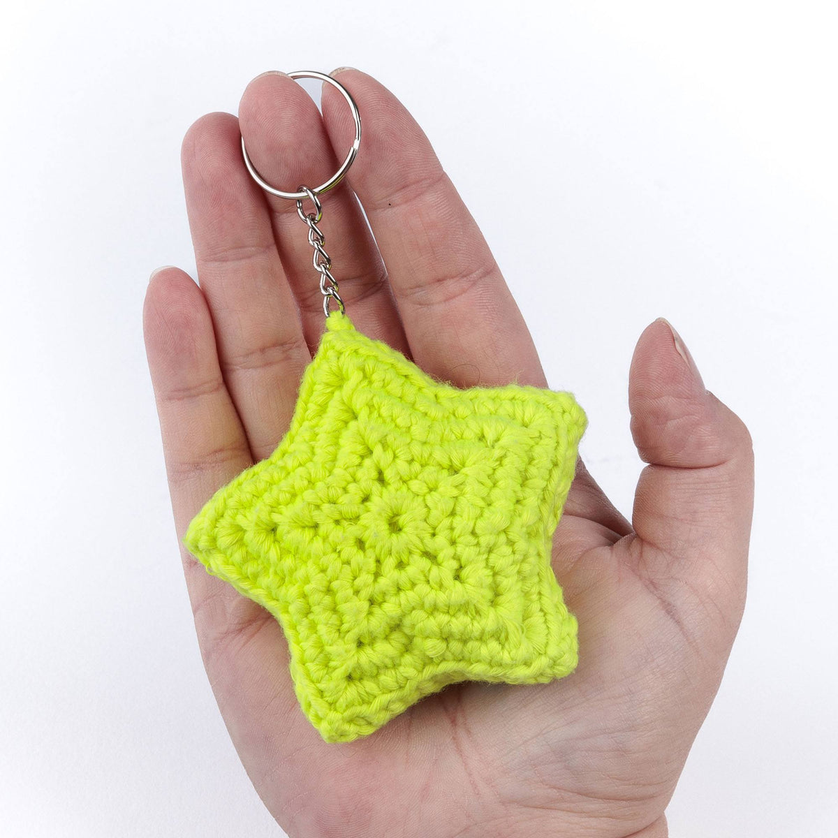 Super Glowing Star Charm made using Red Heart yarn