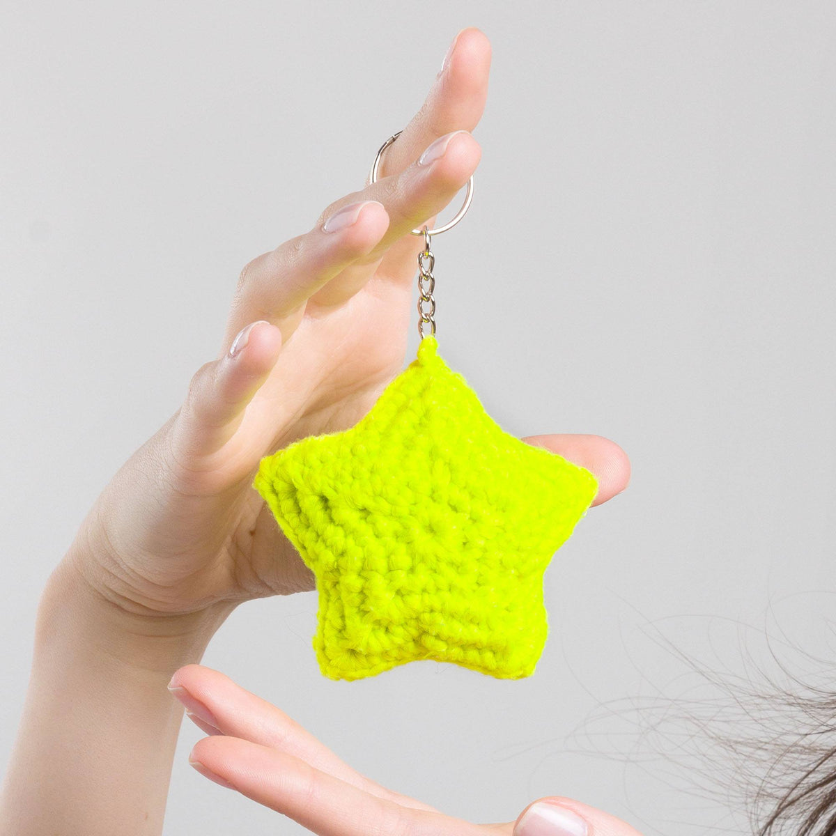 Super Glowing Star Charm made using Red Heart yarn