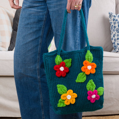 Red Heart Knit Floral Tote Knit Floral Tote made using Red Heart yarn in a styled lifestyle setting